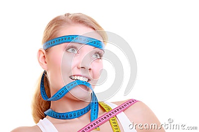 Obsessed girl with violet measure tapes around her head Stock Photo