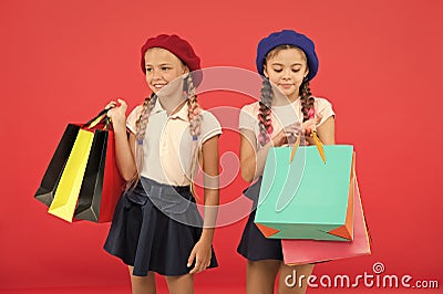 Obsessed with shopping and clothing malls. Shopaholic concept. Signs you are addicted to shopping. Kids cute schoolgirls Stock Photo