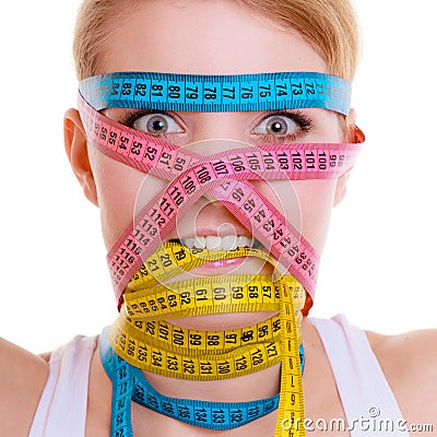 Obsessed sporty fit woman with measure tapes. Time for diet slimming. Stock Photo