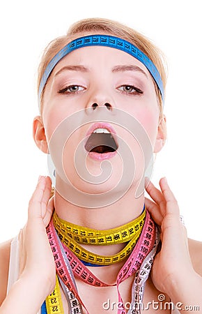 Obsessed sporty fit woman with measure tapes. Time for diet slimming. Stock Photo