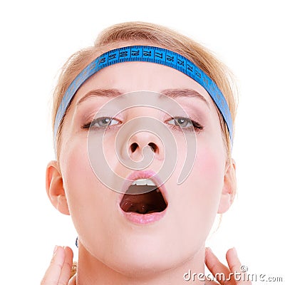 Obsessed sporty fit woman with measure tapes. Time for diet slimming. Stock Photo