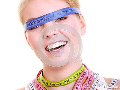 Obsessed woman with colorful measure tapes Stock Photo