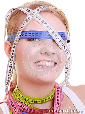 Obsessed woman with colorful measure tapes Stock Photo