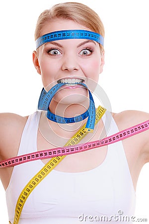 Obsessed woman with measure tapes. Diet. Stock Photo