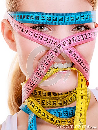 Obsessed woman with measure tapes. Diet. Stock Photo
