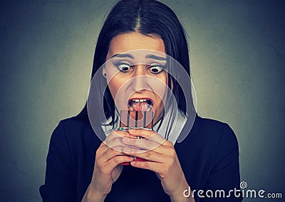 Obsessed woman tired of diet restrictions craving sweets chocolate Stock Photo