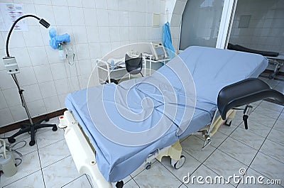 Obstetric bed at the delivery room of the maternity hospital, medical equipment set Stock Photo