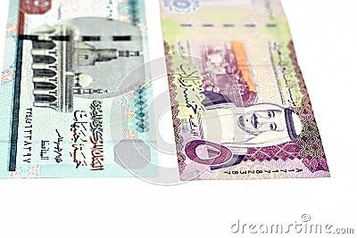 The obverse sides of Saudi Arabia 5 five riyals banknote with 5 LE five Egyptian pounds bill isolated on a white background, Stock Photo
