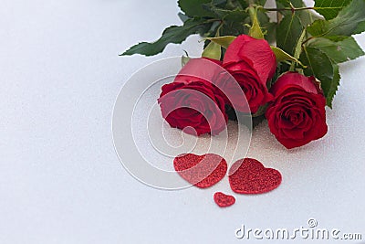 Occasional beautiful red roses with decorative hearts and a place for dedications or wishes Stock Photo