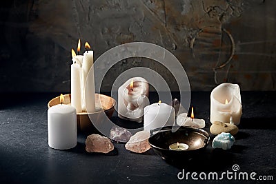 Burning candles and crystals for magic ritual Stock Photo