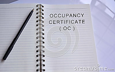 Occupancy certificate text written on a notepad with a pen Stock Photo