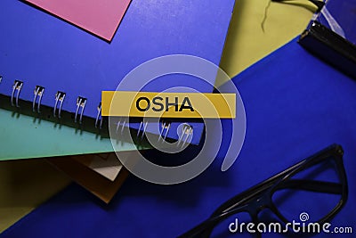 Occupational Safety and Health Administration Osha on sticky Notes isolated on Office Desk Background. Stock Photo