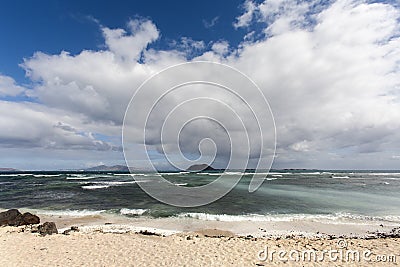 Ocean beach with volcano view Stock Photo