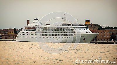 Ocean cruise ship at the entrance to Venice, Italy in the evening, at sunset Editorial Stock Photo