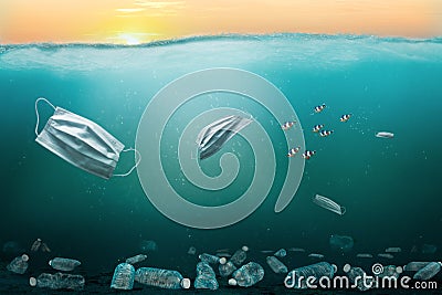 Ocean. Environmental Pollution Problem With Surgical Masks and Plastics Stock Photo