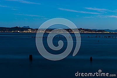 Ocean inlet and city of Astoria on distance Stock Photo
