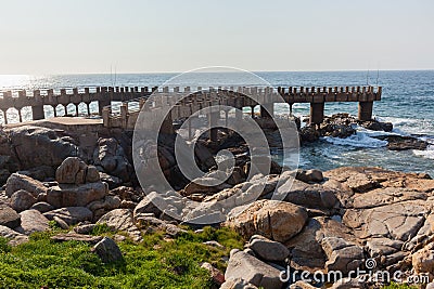 Ocean Pier Fishing Rocky Coastline Stock Photo