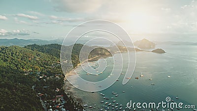 Ocean pier town aerial: sun cityscape with boats, ships, vessels at waterfront. Cottages, lodges Stock Photo