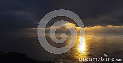 Ocean storm with lgihting at sunset Stock Photo