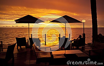 Ocean Sunset Holiday Fiji Umbrella Chairs Stock Photo