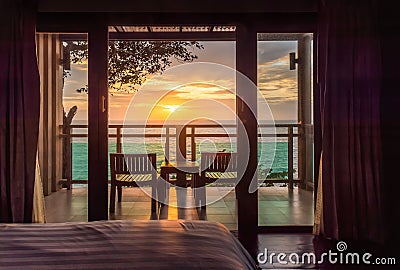 Ocean sunset view from bedroom balcony for travel concept Stock Photo