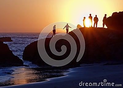 Ocean Sunset Watchers Stock Photo