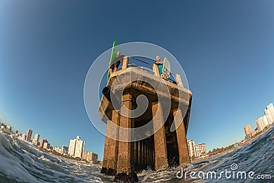 Ocean Waters Surfing Durban Pier Paddle Jump surfers swimmers Editorial Stock Photo