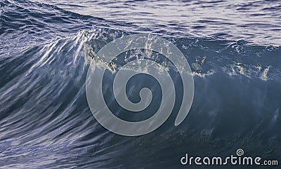 Ocean wave closeup detail of upright crashing hollow breaking water. energy power of nature. Stock Photo