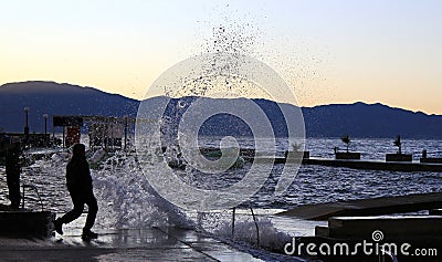 Ocean wave splash human silhouette Stock Photo