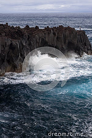 Ocean Waves break on Volcanic Cliffs, Azores Stock Photo