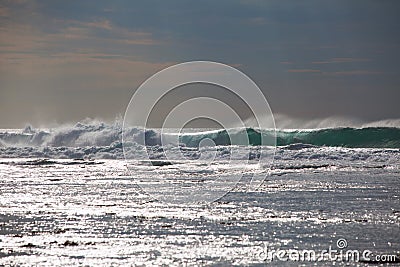 Ocean waves close up and the sparkle of water at sunset Stock Photo