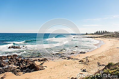 Ocean waves and sandy beach on a sunny day. Nature tropical paradise background. Tuross Head, NSW, Australia Stock Photo