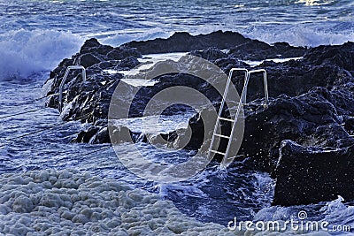 Ocean waves and stairs in public pool of Termas da Ferraria Stock Photo
