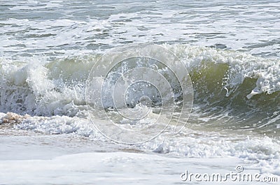 Ocean waves washing on beach Stock Photo