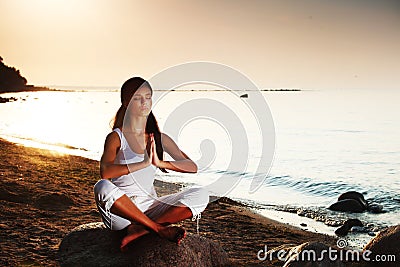 Ocean yoga sunrise Stock Photo