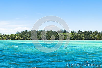 Oceanic landscape. blue aqua water with tropical island background. Stock Photo