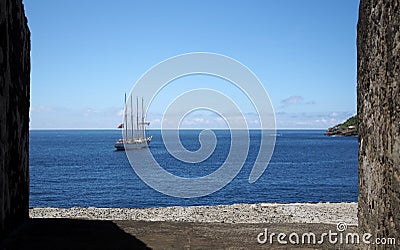 Oceanview from the Fort of Sao Sebastiao, through the port in the fortifications wall, Angra do Heroismo, Portugal Stock Photo