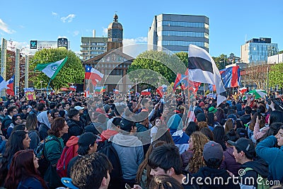 Puerto Montt, Chile; Oct 25, 2019: Protesters with Chilean flag at Puerto Montt city Editorial Stock Photo