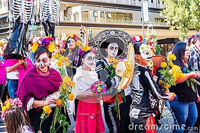 Oct 20, 2019 San Jose / CA / USA - Participants at Dia de Los Muertos Day of the Dead procession wearing sugar-skull make-up; Editorial Stock Photo