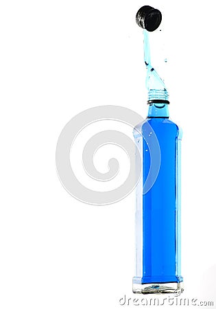 Octagon shaped glass bottle with water frozen with high speed flash photography Stock Photo