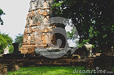 Octagonal Chedi and ruined Buddha figure at Wat Mahathat historical park, Ayutthaya, Thailand. Stock Photo