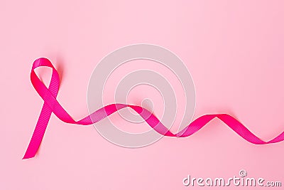 October Breast Cancer Awareness month, Pink Ribbon on pink background for supporting people living and illness. International Stock Photo