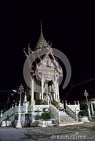 Crematorium building in Wat Pho at night on Suranaree Road Nakhon Ratchasima Thailand Stock Photo