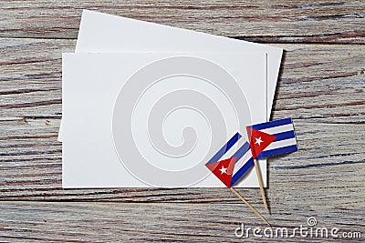 October 10, happy independence Day of Cuba. the concept of patriotism , freedom and independence. Mini flags with a white card on Stock Photo