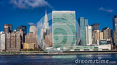 OCTOBER 24, 2016 - NEW YORK - Skyline of Midtown Manhattan seen from the East River showing the Chrysler Building and the United N Editorial Stock Photo