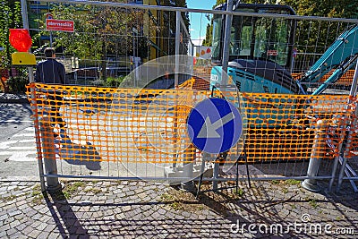 October 2020 Parma, Italy: Construction on road close-up across city architecture. Road sign arrow close-up Editorial Stock Photo