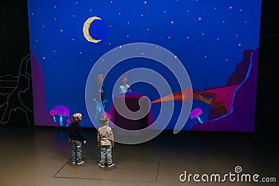 October 2023 - Prague, Czechia. Kids playing interactive screen in Dinosauria. Editorial Stock Photo