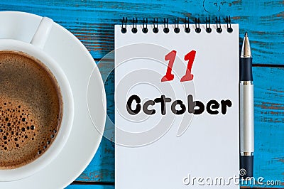 October 11th. Day 11 of month, calendar on notepad near morning hot drink cup at architect workplace background. Autumn Stock Photo