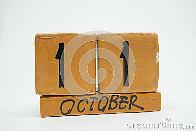 october 11th. Day 11 of month, handmade wood calendar isolated on white background. autumn month, day of the year concept Stock Photo