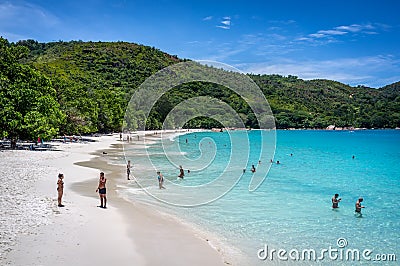 October 20th 2018 - Praslin, Seychelles - Tourists enjoying the calm and clean sea water of Anse Lazio in Seychelles Editorial Stock Photo
